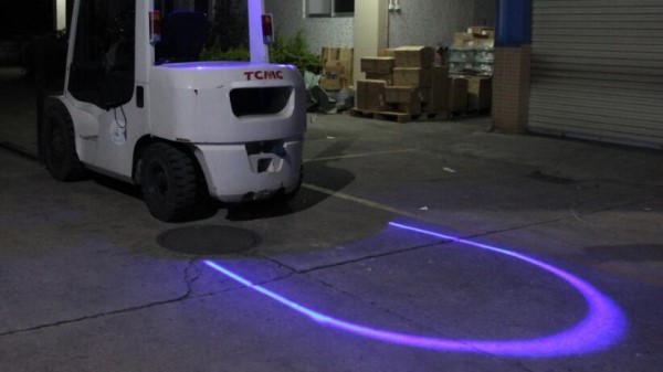 Image of a forklift with a blue spotlight in the rear