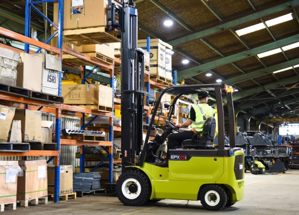 A Clark Electric Forklift removing a load in a warehouse