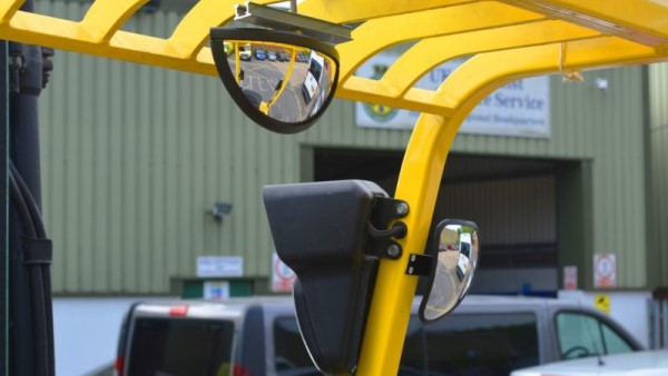 An image of a forklift interior with rear- and side-view mirrors