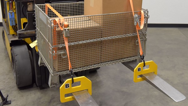 An image of a forklift lifting a person in a safety cage