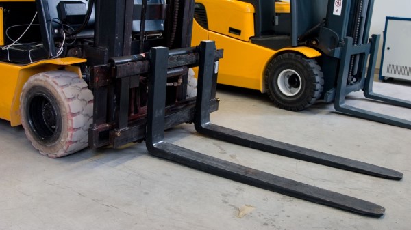 An image of a forklift with lowered fork