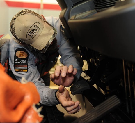 A mechanic testing the brake system after bleeding Toyota forklift brakes