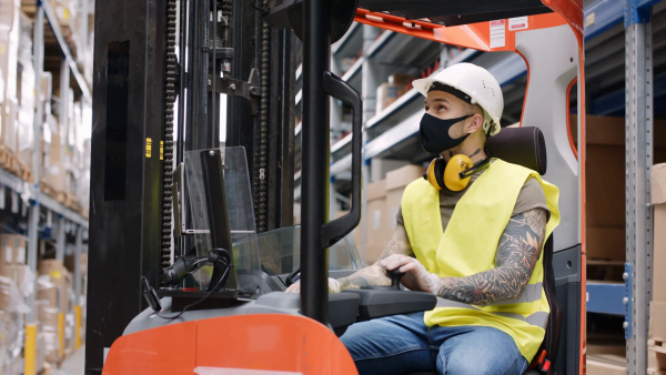 An image of a forklift operator sitting comfortably on an ergonomic seat