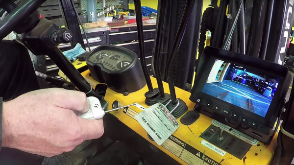 An image of a forklift dashboard with a blindspot camera system
